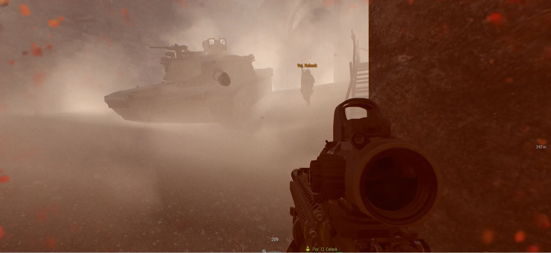 Infantry and a vehicle moving through dust