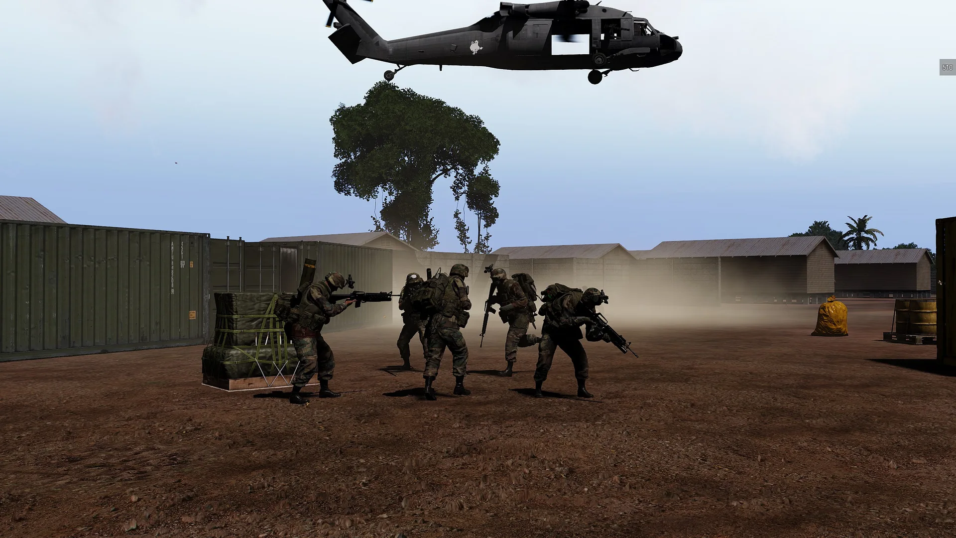 Soldiers below a hovering helicopter during a previous unit operation